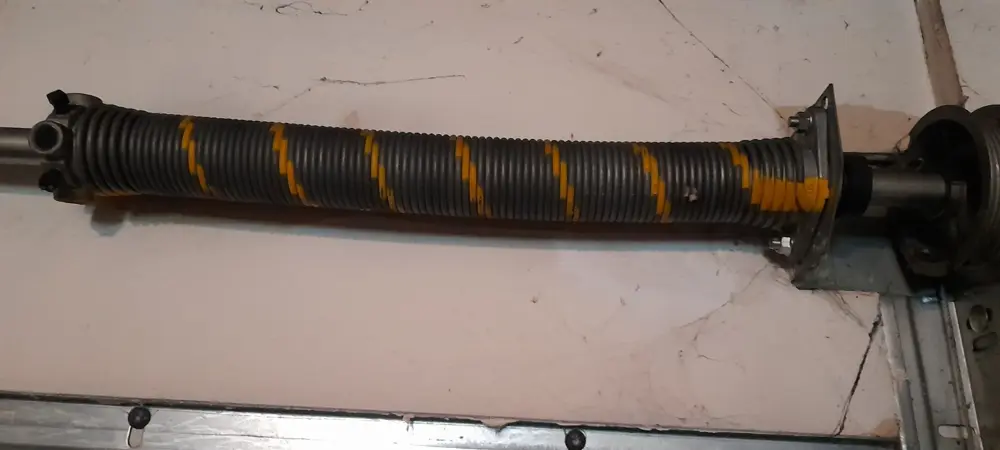 Ressort de torsion d’une porte sectionnelle